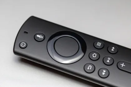 Close-up of a black streaming media remote control with navigation buttons