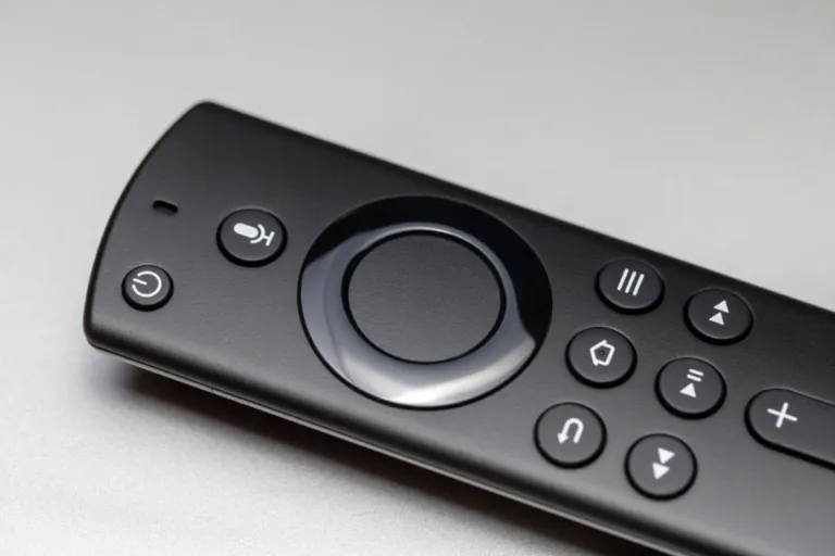Close-up of a black streaming media remote control with navigation buttons