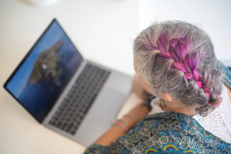 Woman using a laptop to take an online course